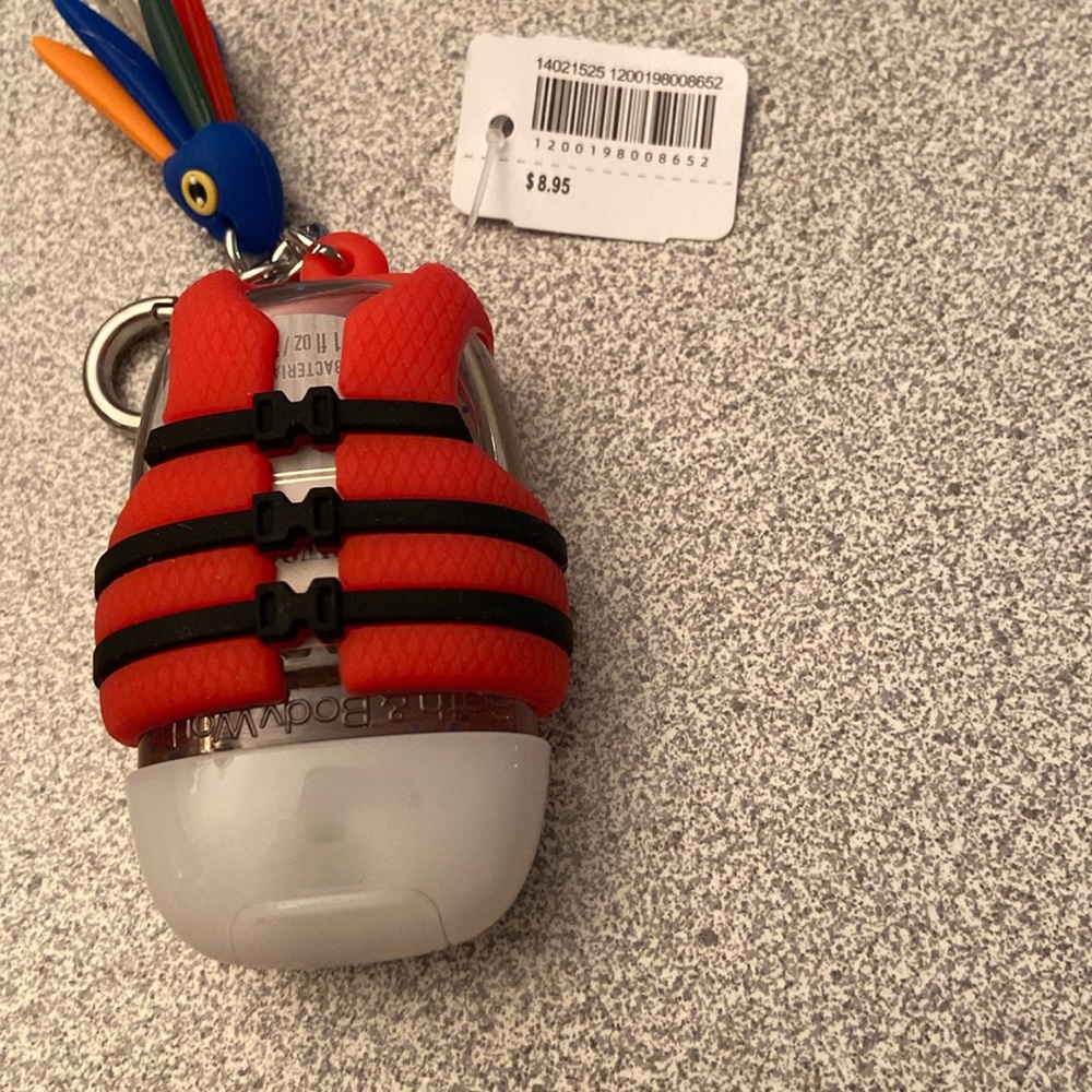 Life jacket hand sanitizer and sanitizer holder